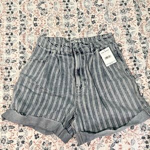 Adorable High waisted denim shorts from free people. NWT size 31.